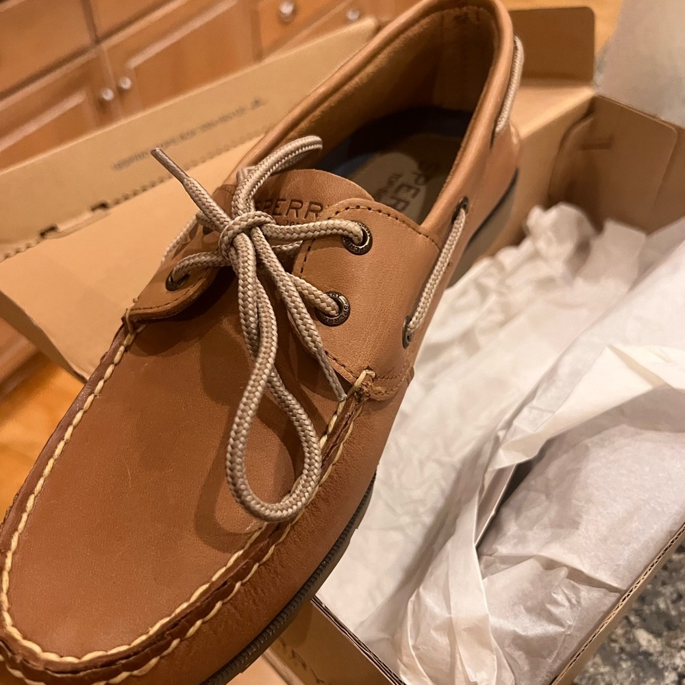 Sperry size 10.5.Never worn.Original box,& paper.Left shoe never left the box.